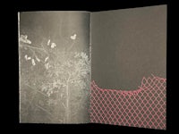 a black and white book with a picture of a fence